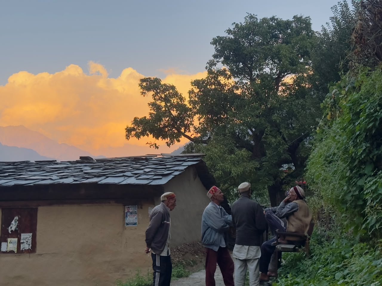 People sharing a quiet moment in Kuarsi village